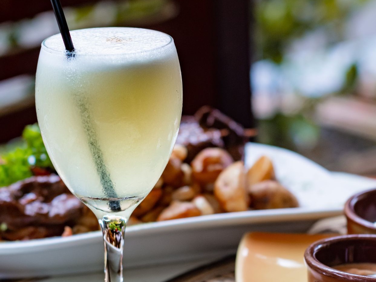 clear wine glass with yellow liquid