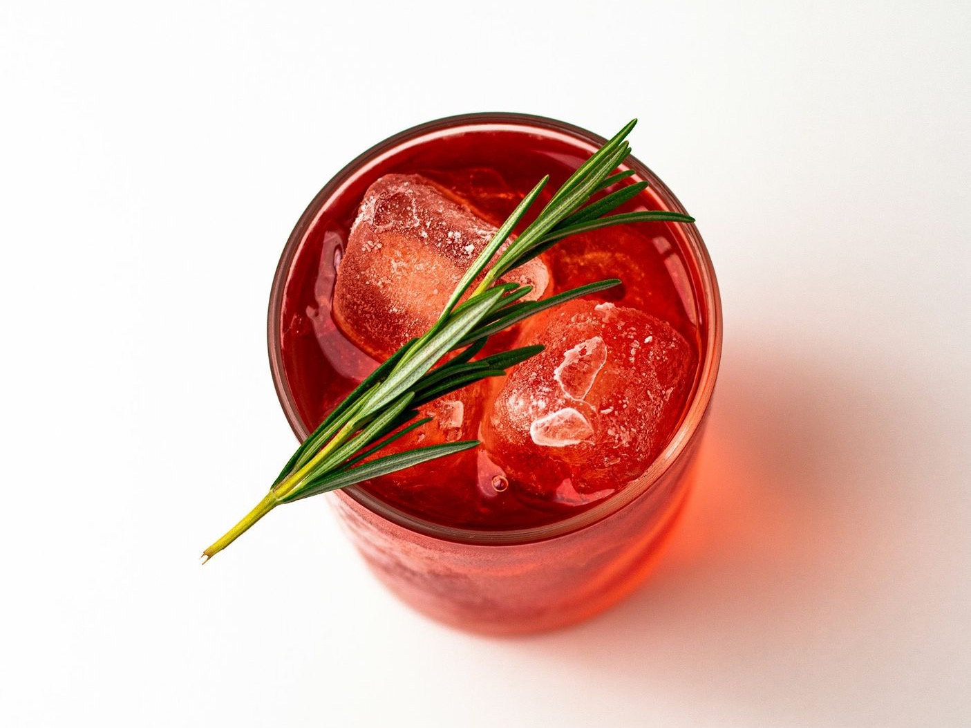 red liquid in clear glass jar