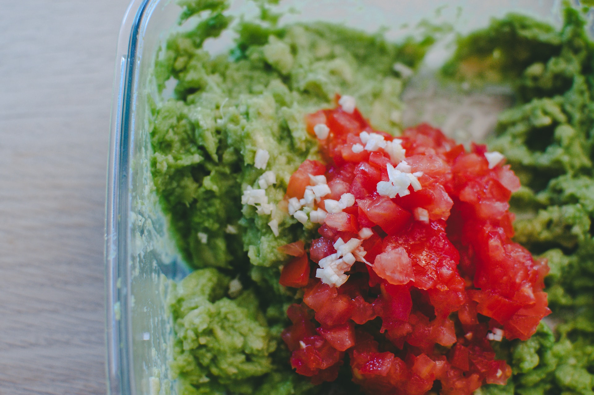 green and red vegetable in clear glass bowl