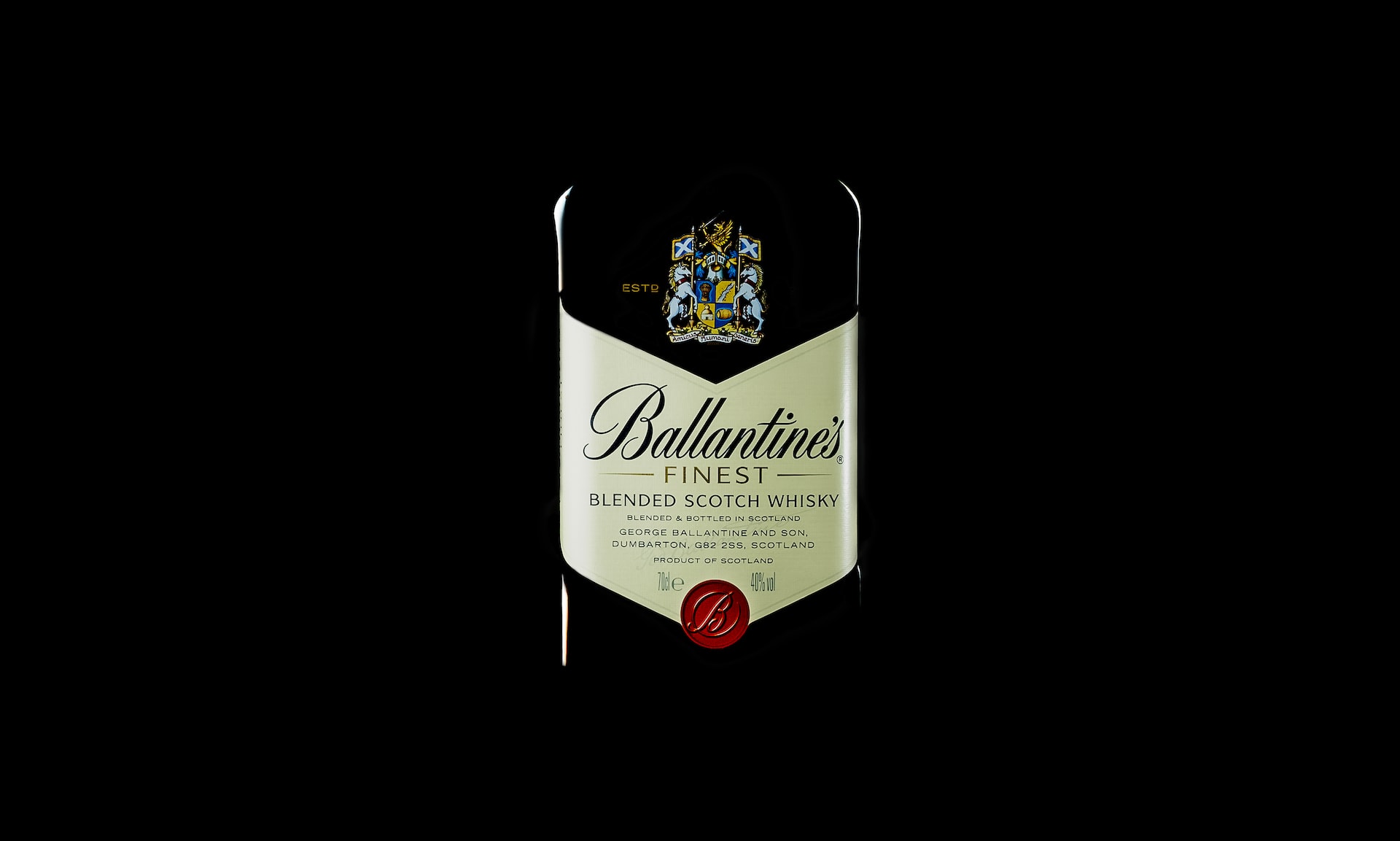 a bottle of wine on a black background