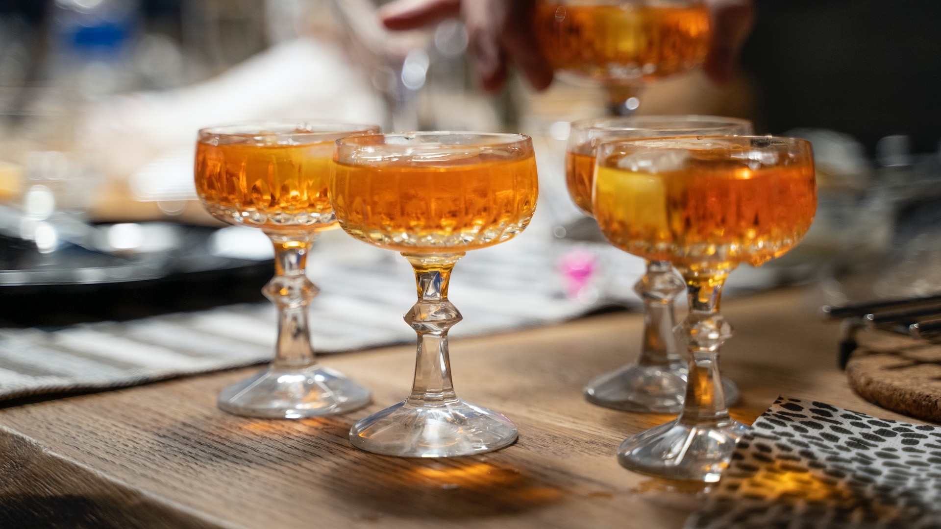 clear wine glass with brown liquid